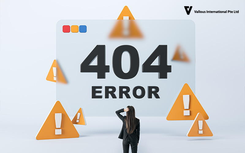 Vallous International laptop screen showing a 404 error message.
